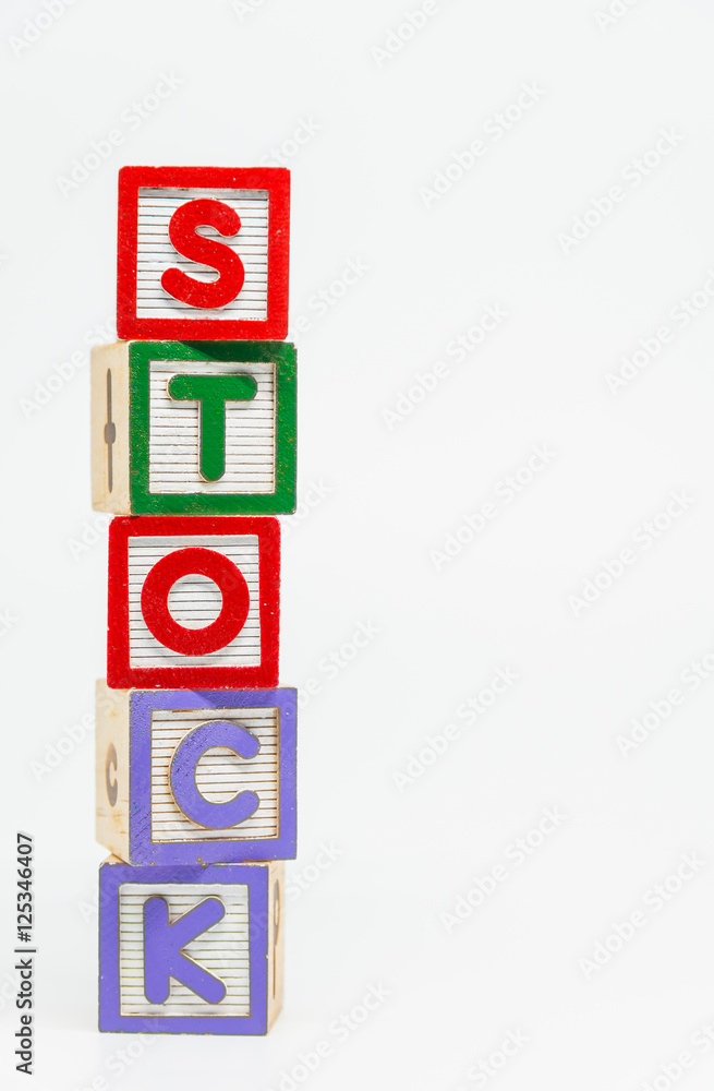STOCK word wooden block arrange in vertical style on white background and selective focus STOCK word wooden block arrange in vertical style on white background and selective focus