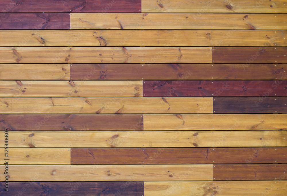 Wooden background of gorizontal yellow and brown pallets Wooden background of gorizontal yellow and brown pallets