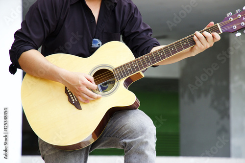 Man is playing guitar