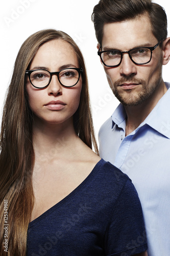 Serious couple wearing spectacles, portrait