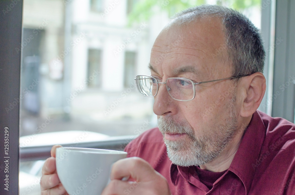 aged man with a cup of tea aged man with a cup of tea
