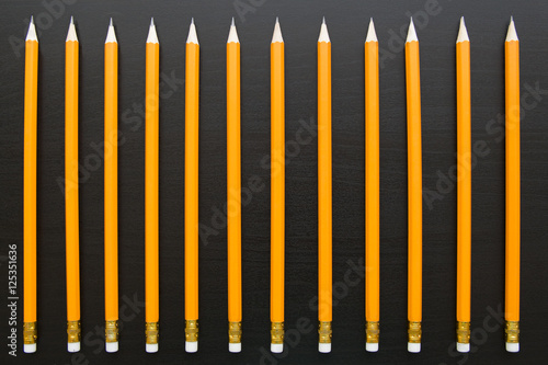 Row of identical pencils photo