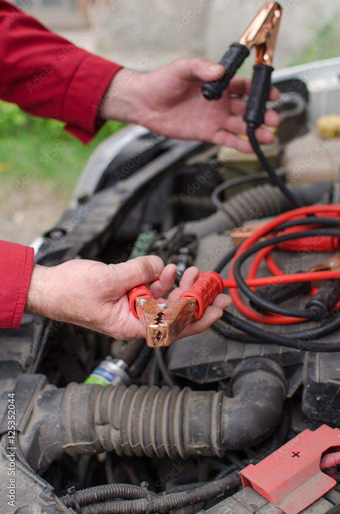 Aged man fixing the car Aged man fixing the car