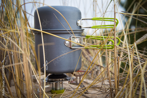 Camping gas cooking stove on the beach