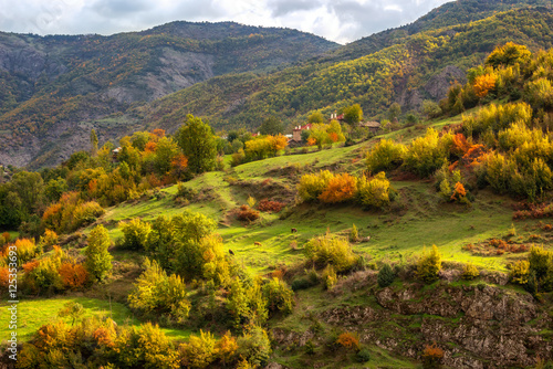 Autumn is coming... / Amazing day view with a sun-drenched little village in Rhodopi Mountains, Bulgaria