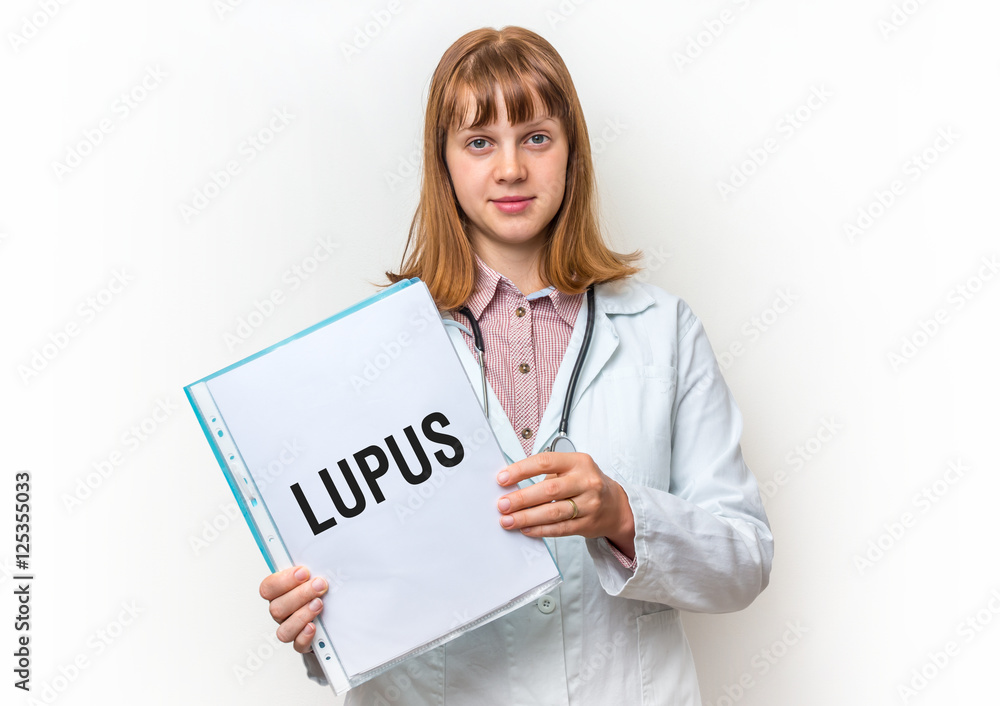 Female doctor showing clipboard with written text: Lupus Female doctor showing clipboard with written text: Lupus