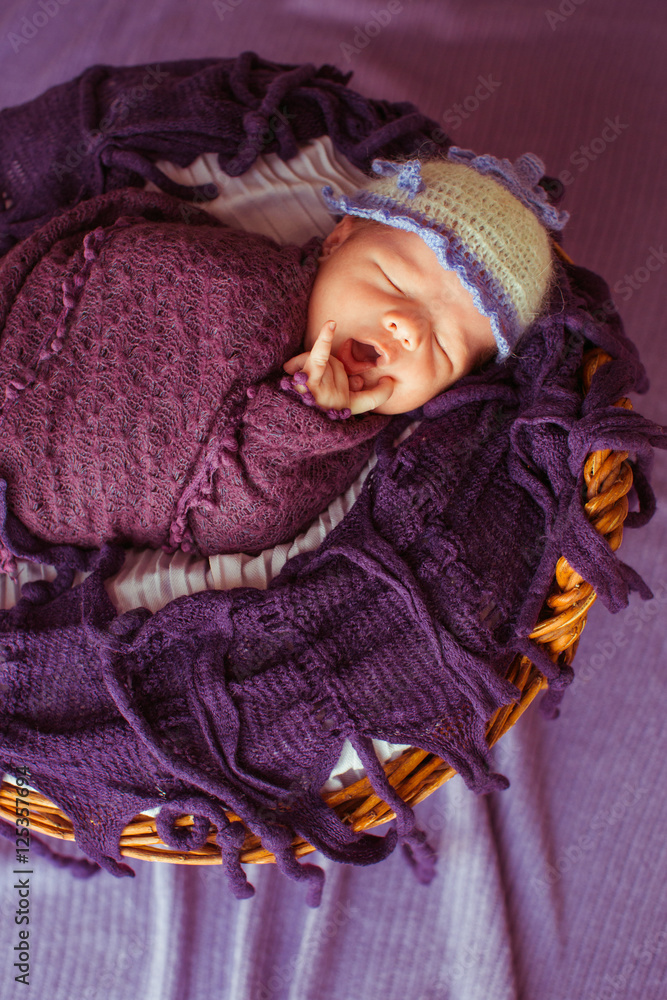 Little yawing baby in a basket Little yawing baby in a basket