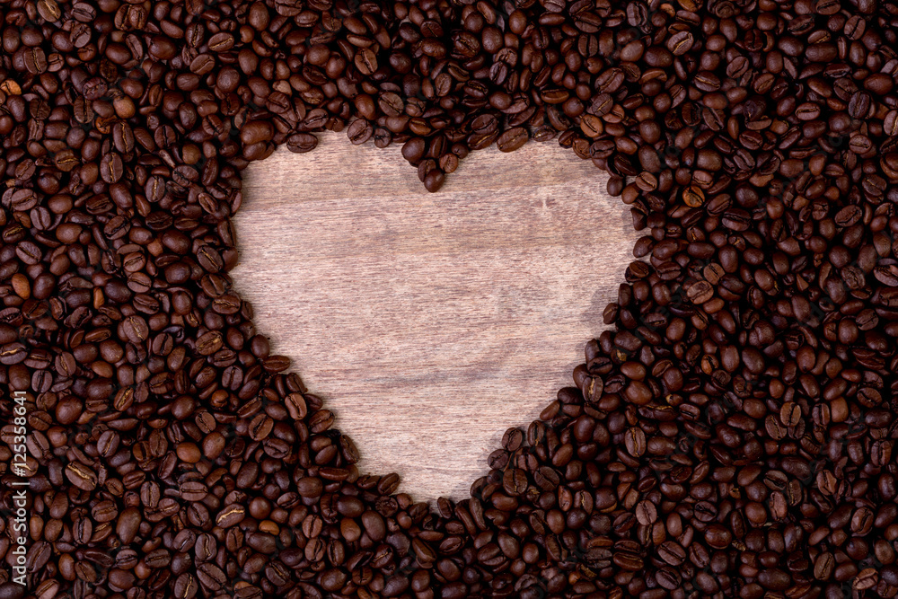 heart symbol sorrounded by coffee beans heart symbol sorrounded by coffee beans