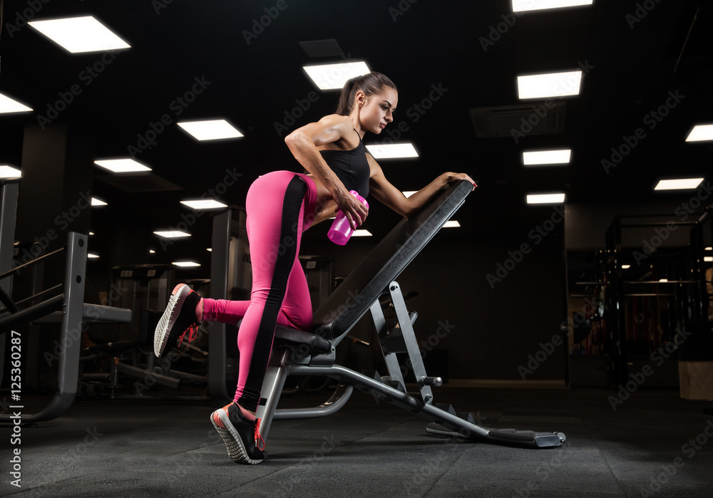 fitness girl exercising with barbell in gym fitness girl exercising with barbell in gym