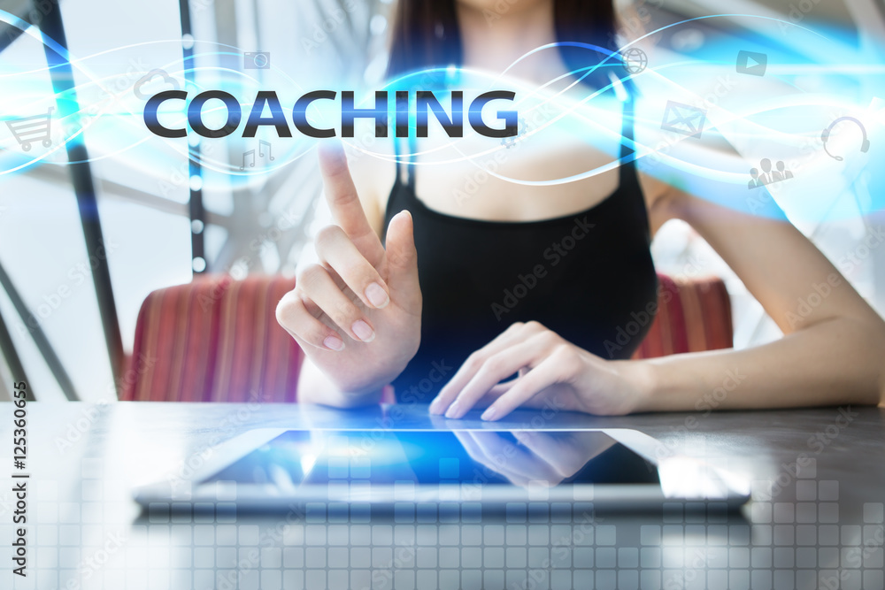 Woman is using tablet pc, pressing on virtual screen and selecting coaching Woman is using tablet pc, pressing on virtual screen and selecting coaching
