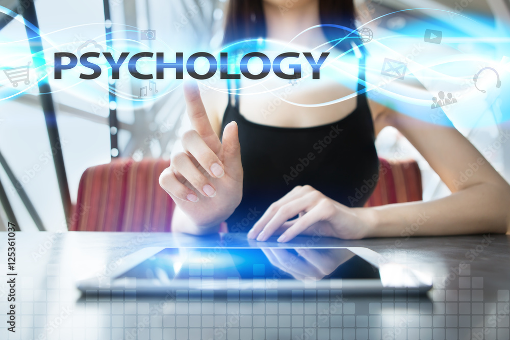 Woman is using tablet pc, pressing on virtual screen and selecting psychology Woman is using tablet pc, pressing on virtual screen and selecting psychology