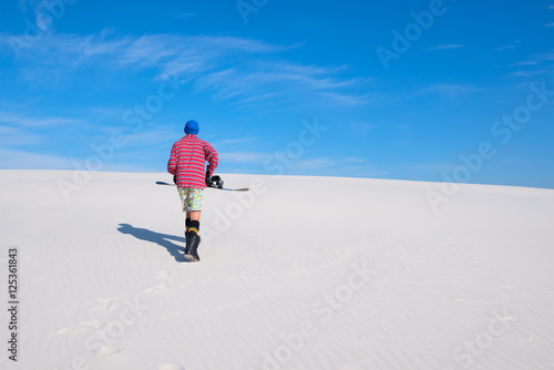 Boarder goes up the dune