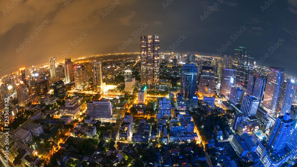 Cityscape night scene of Bangkok, Capital of Thailand with fish