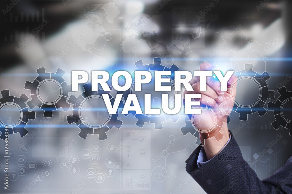 Businessman is drawing on virtual screen. property value concept. Businessman is drawing on virtual screen. property value concept.