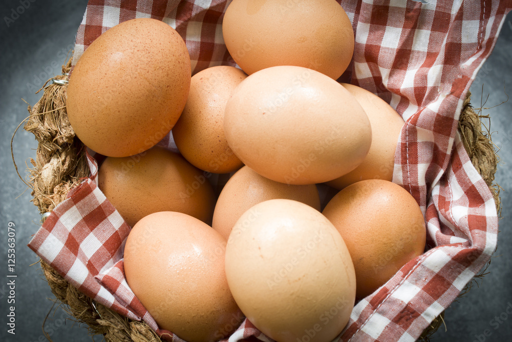 eggs in a basket wooden background eggs in a basket wooden background