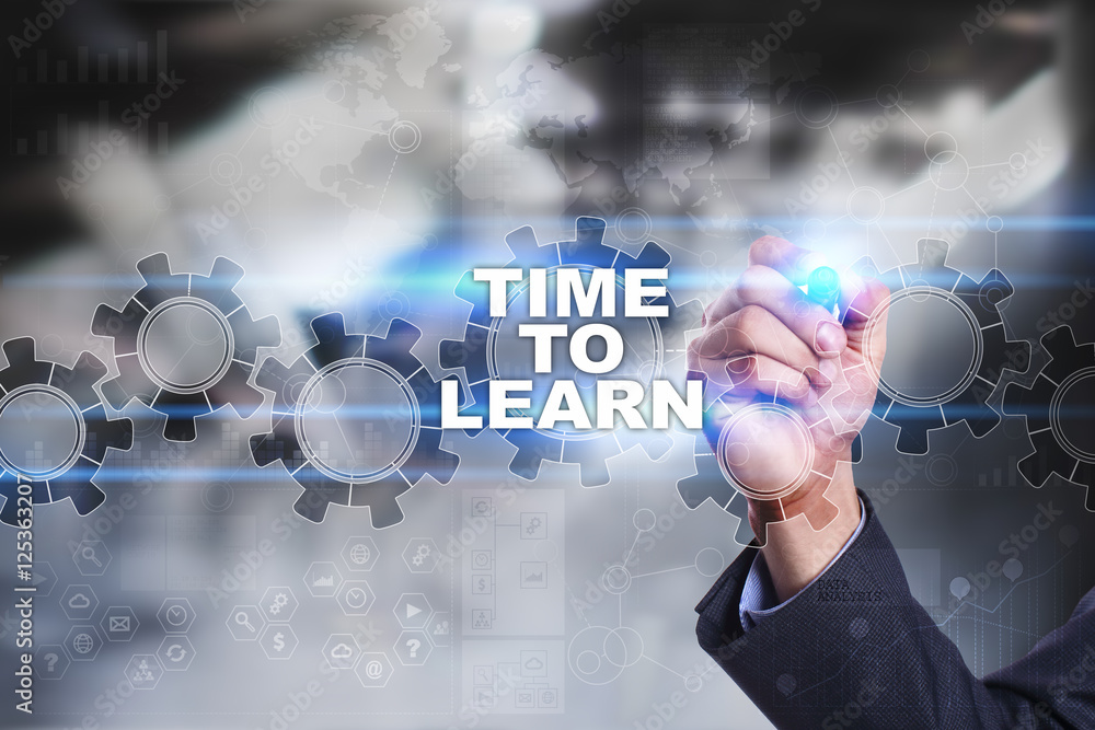 Businessman is drawing on virtual screen. time to learn concept. Businessman is drawing on virtual screen. time to learn concept.