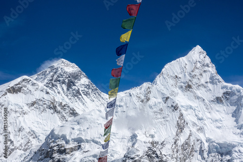 Beautiful Landscape of  Everest and Lhotse peak with colorful Nepali flag from Kala Pattar view point. Gorak Shep. During the way to Everest base camp. Sagarmatha national park. Nepal.