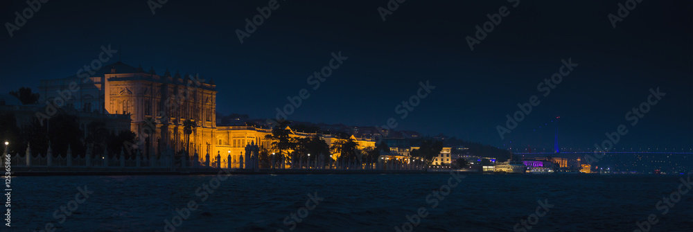 Dolmabahce Palace and The Bosphorus Bridge in Istanbul at night