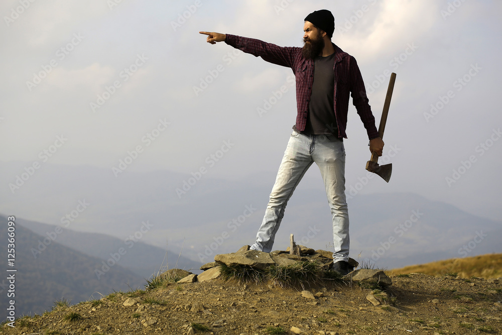 bearded man with ax on mountain bearded man with ax on mountain