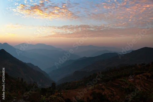 Evening view of blue horizons in Himalayas and red clouds © Daniel Prudek