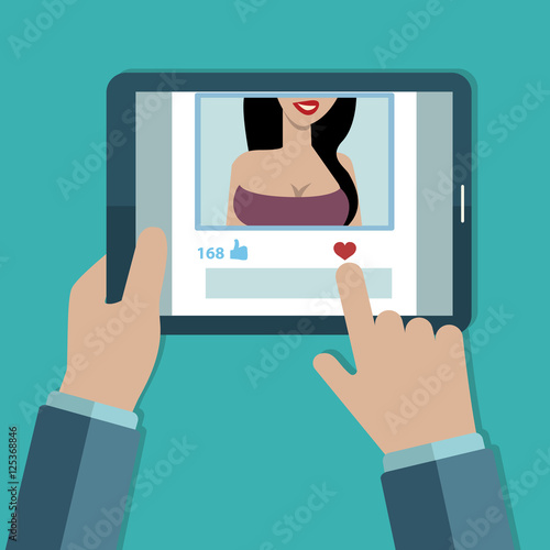Man liking photo of sexy woman on his tablet