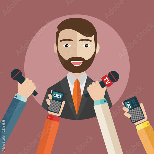 Businessman giving an interview in the presence of journalists with microphones