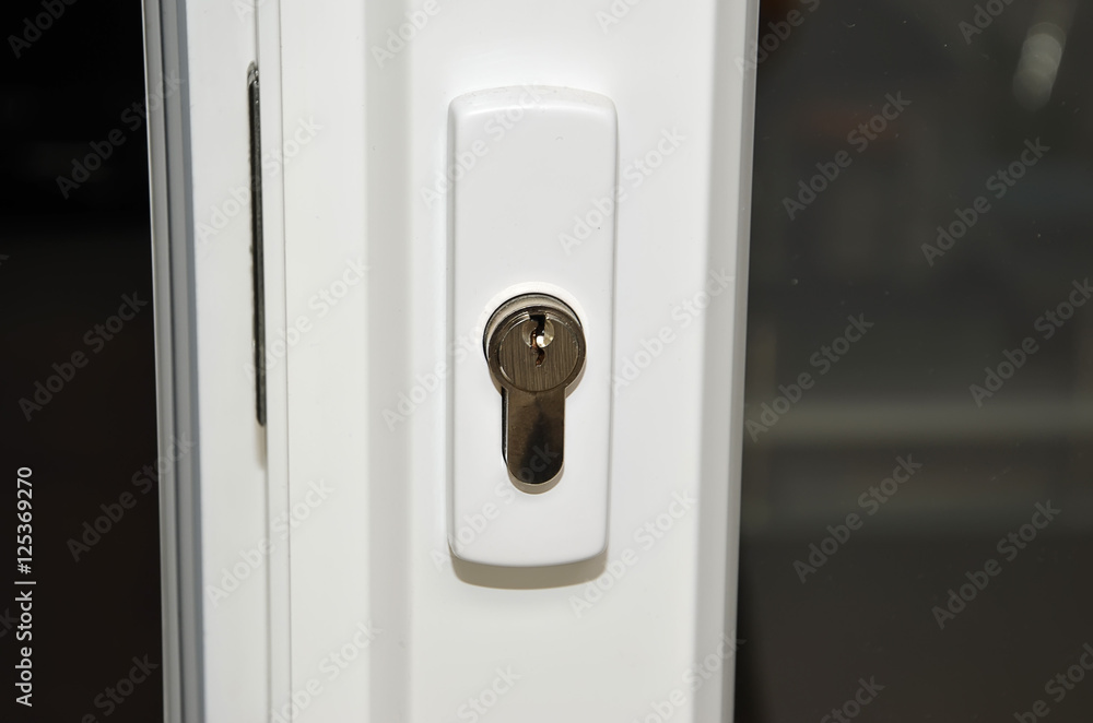 detail of white plastic sliding door with lock photography detail of white plastic sliding door with lock photography
