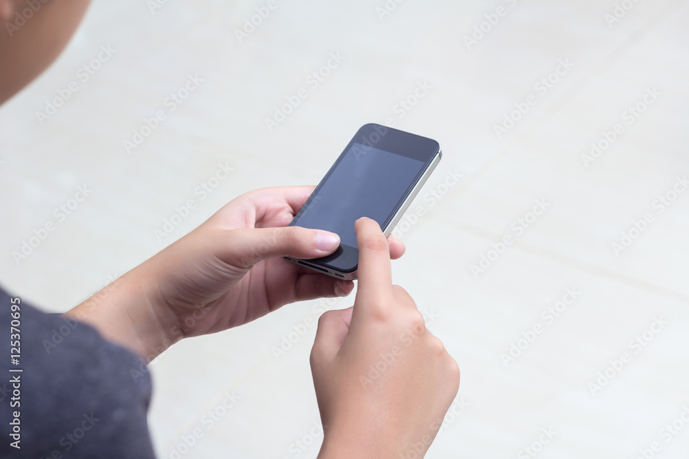 Woman with modern mobile phone in hands touching on a blank scre Woman with modern mobile phone in hands touching on a blank scre