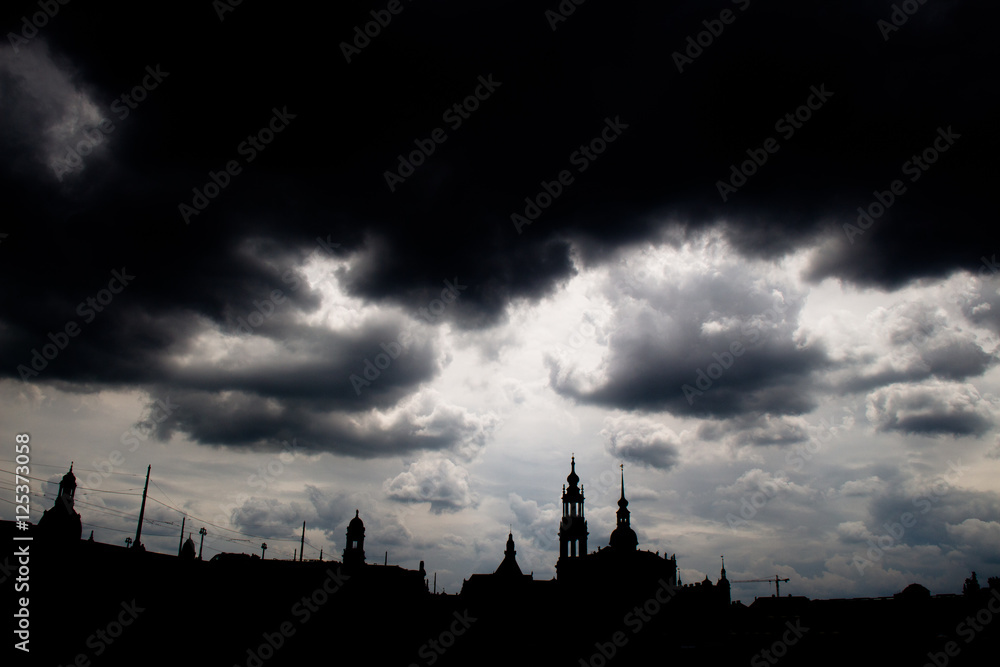 Fototapeta premium Shadow siluette of the city skyline dresden with dark storm clouds 