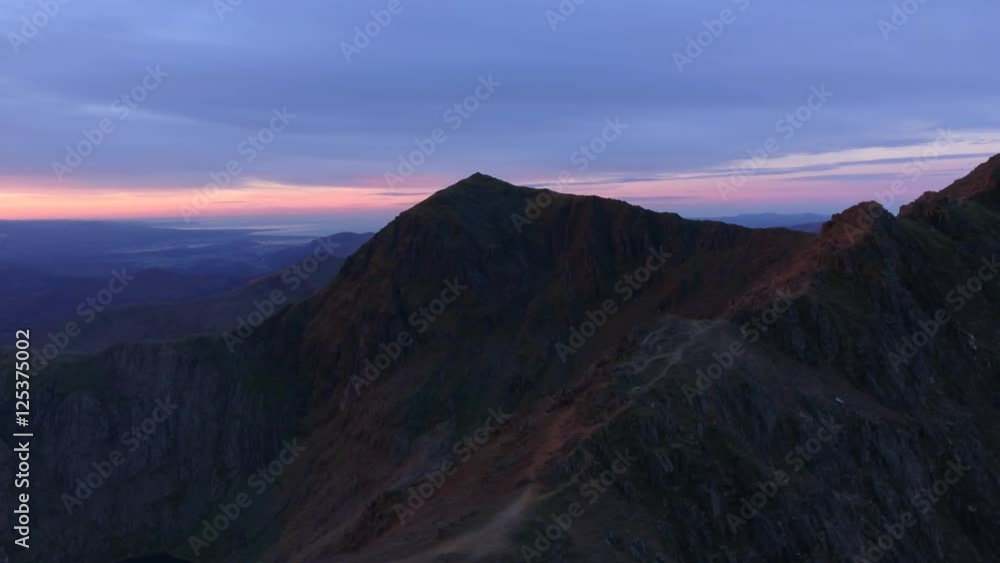 Long tracking shot behind Crib Goch summit with a view of Mount Snowdon. Long tracking shot behind Crib Goch summit with a view of Mount Snowdon.