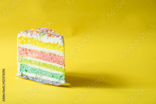 rainbow butter cake over yellow background