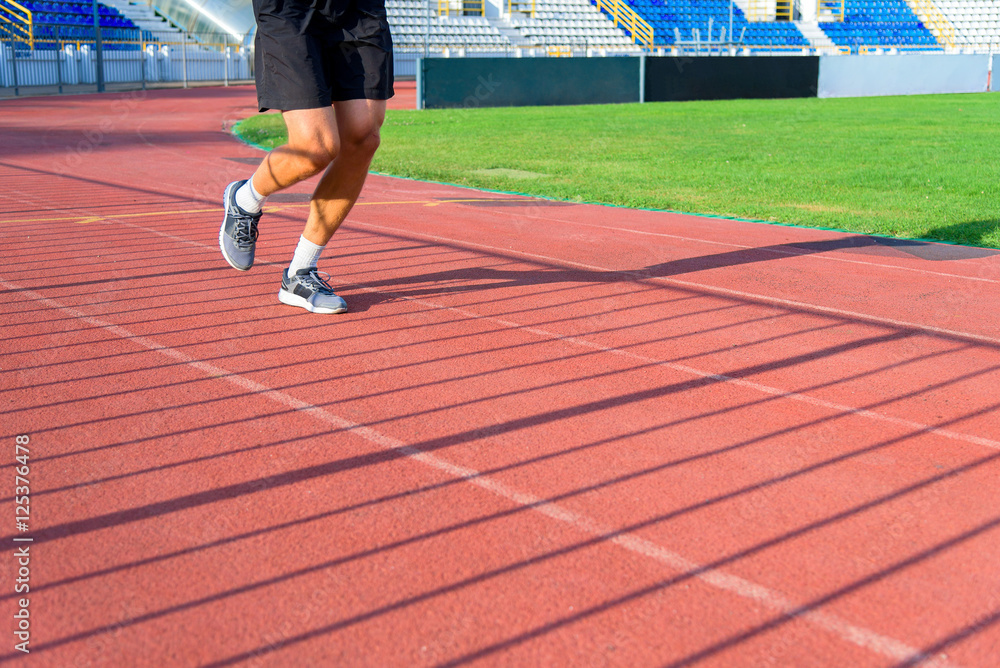 The sportsman the athlete trains at stadium. The sportsman the athlete trains at stadium.