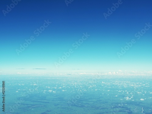 Clear blue sky view from airplane window © Thitinat.K