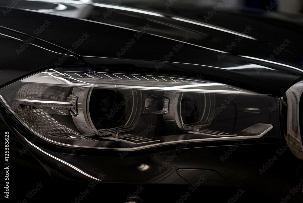 Modern car headlights. Exterior detail. Modern car headlights. Exterior detail.