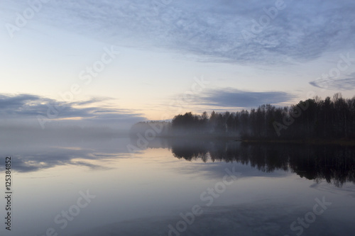 Fototapeta Naklejka Na Ścianę i Meble -  Silent foggy evening in Finland. Calm waters, cold night. Beautiful and silent.