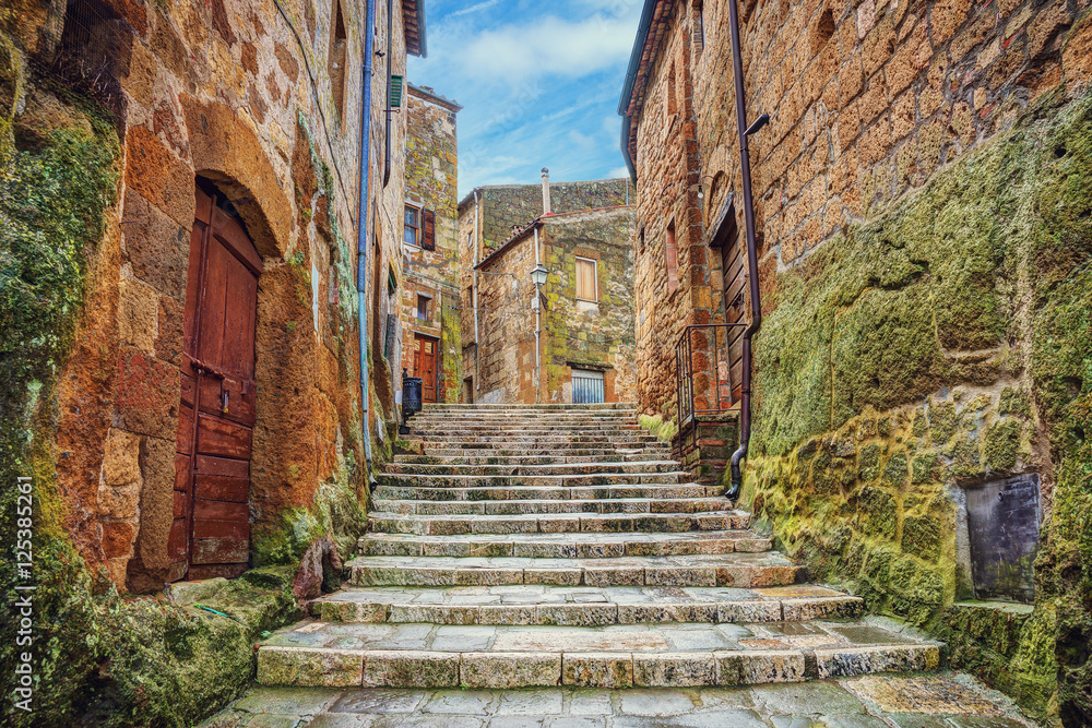 Alley in old town Pitigliano, Tuscany, Italy