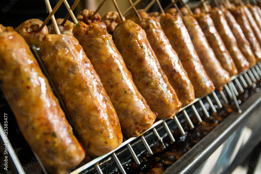 Big thai spice sausage on grill,It smells fragrant and full of thai spice.At 