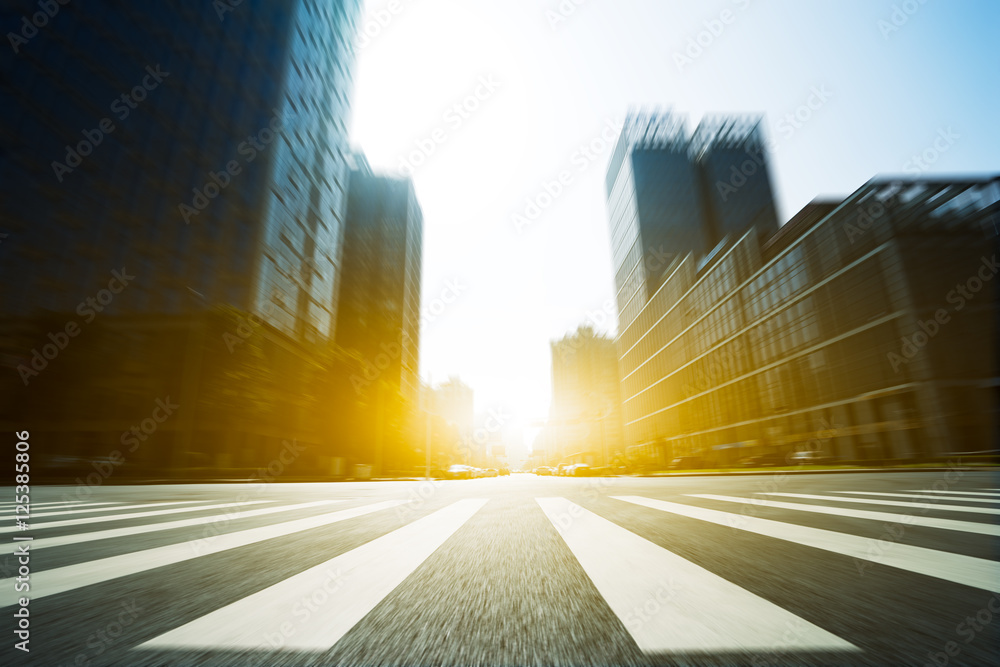blur road and modern office buildings in hangzhou with sunbeam - obrazy, fototapety, plakaty 