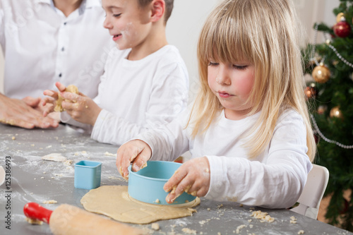 childs using christmas cookie molds