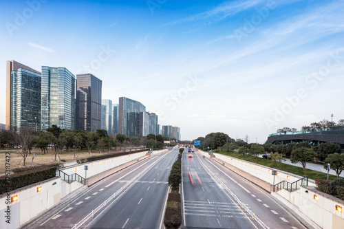 traffic on road and modern buildings in hangzhou
