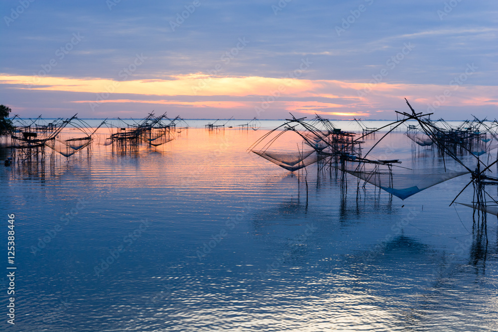 Many square dip net with boat in the morning at Pakpra, Phatthalung, Thailand