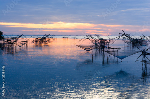 Many square dip net with boat in the morning at Pakpra, Phatthalung, Thailand