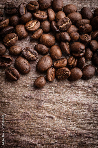 Coffee beans on grunge stone background