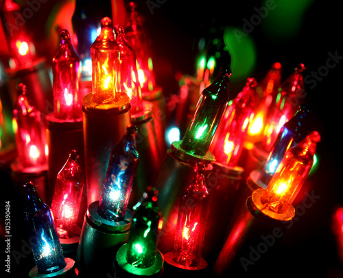 Christmas, New Years garland colorful lights with bokeh dark background