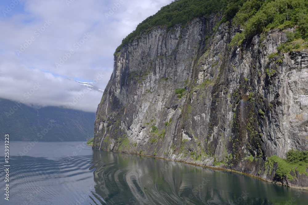 Early morning passage through the beautiful Geiranger Fiord in Norway