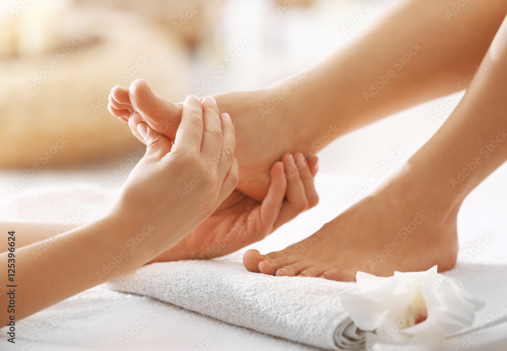 Fototapeta premium Foot massage in spa salon, closeup