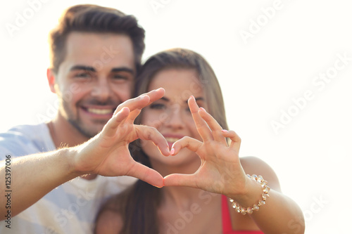 Happy young couple making h...