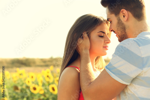 Beautiful young couple embr...