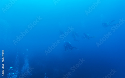 Underwater Background with Silhouettes of Diver