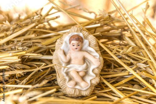 Wallpaper Mural Infant Jesus nativity decoration on a bed of straw against glowi Torontodigital.ca